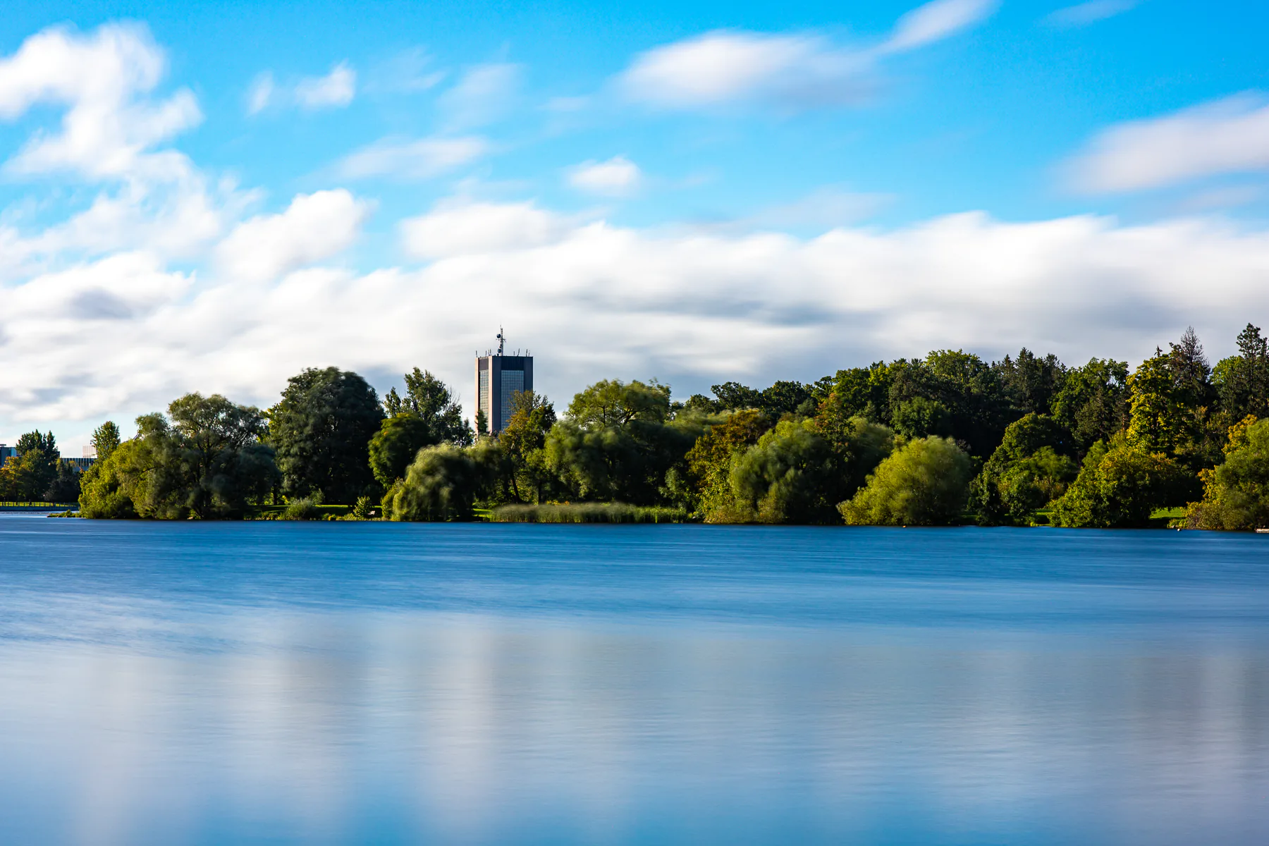 A calm picture of the arboretum and Dunton Tower (Carleton University) from Dow's Lake.  Photo by Jeffrey Meyer. 