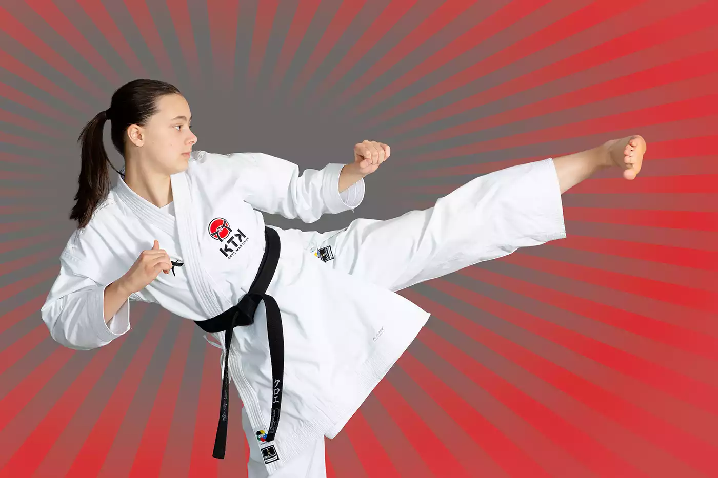 KTK Martial Arts sensei performing a side kick.  Sport photography by Jeffrey Meyer